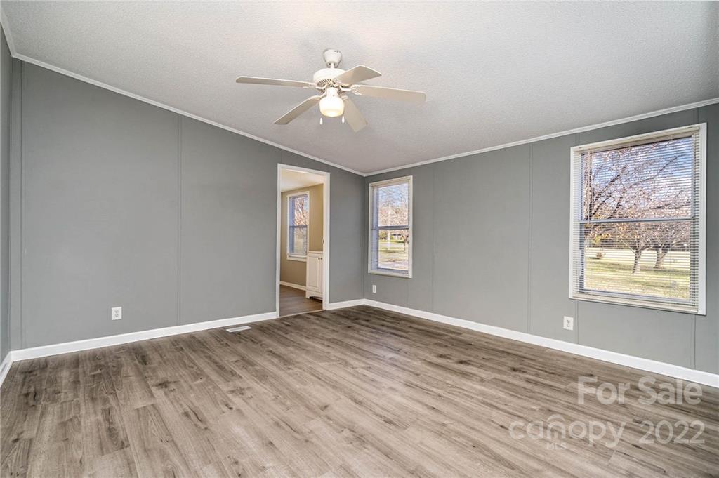 4289 Henry Dellinger Road Maiden, NC 28650 - Photo 20 of 42 a view of an empty room with window and wooden floor