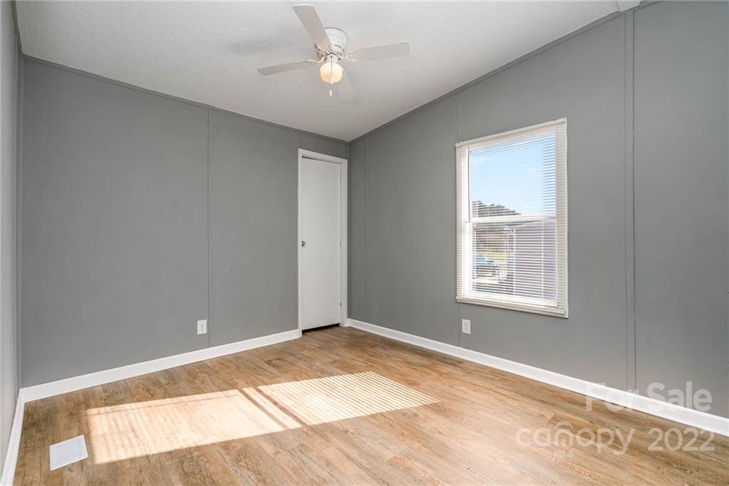 4289 Henry Dellinger Road Maiden, NC 28650 - Photo 2 of 42 a view of an empty room with a window