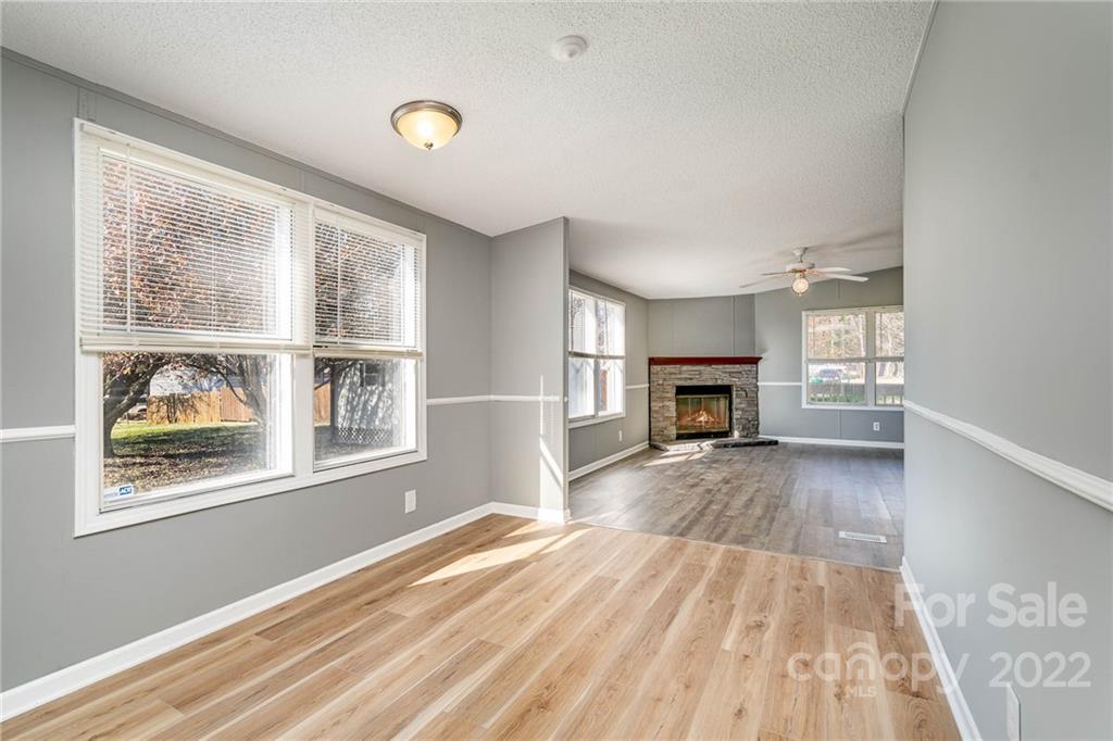 4289 Henry Dellinger Road Maiden, NC 28650 - Photo 26 of 42 a view of an empty room with wooden floor and a window