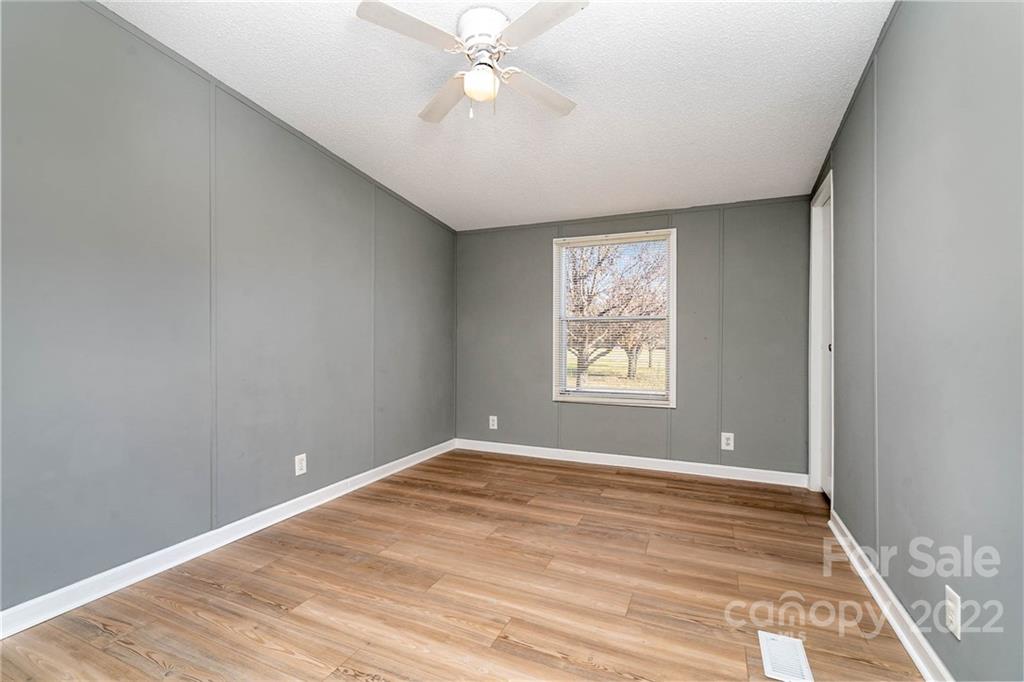 4289 Henry Dellinger Road Maiden, NC 28650 - Photo 3 of 42 wooden floor in an empty room with a window