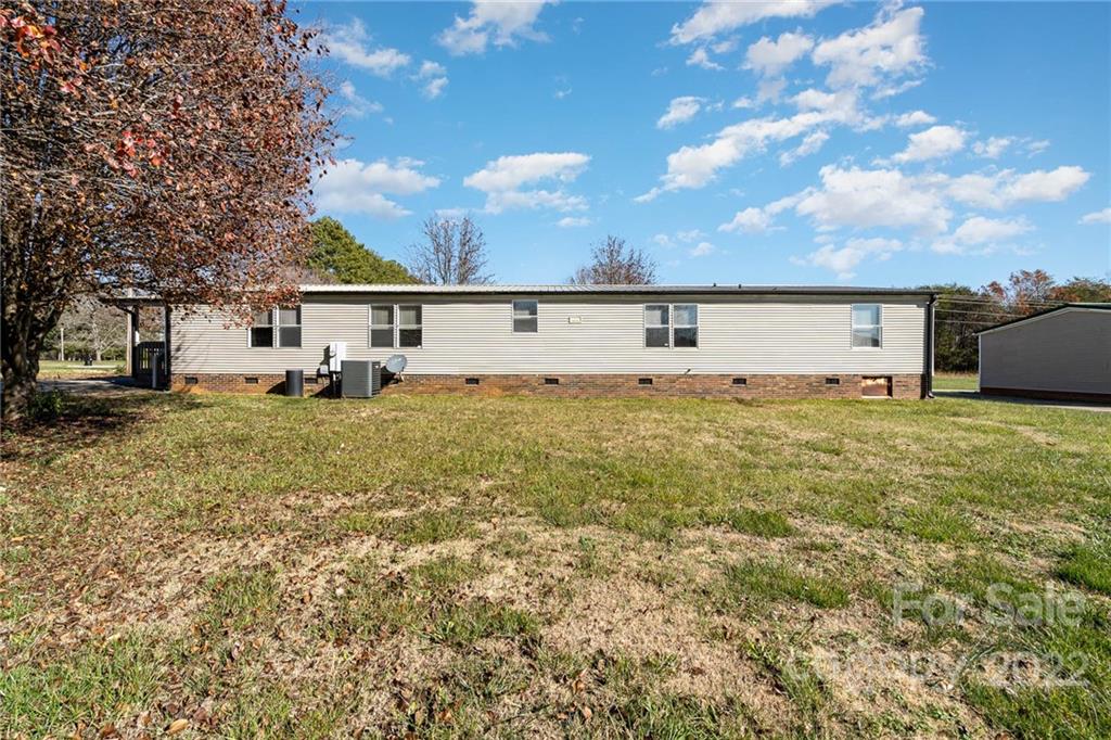 4289 Henry Dellinger Road Maiden, NC 28650 - Photo 36 of 42 a view of a house with a yard