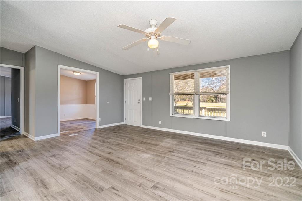 4289 Henry Dellinger Road Maiden, NC 28650 - Photo 9 of 42 wooden floor in an empty room with a window