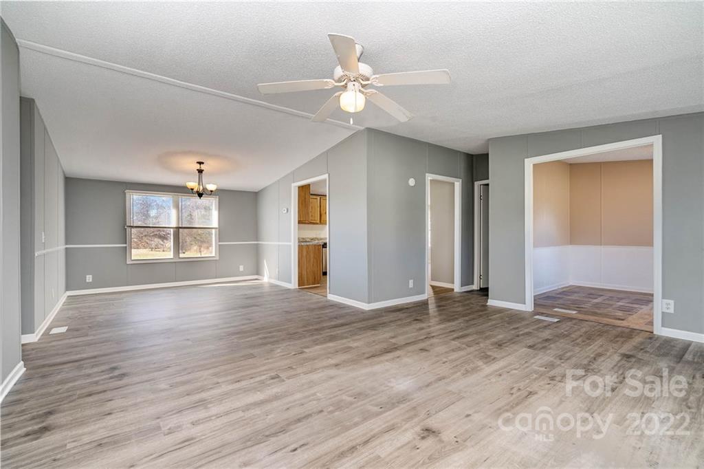 4289 Henry Dellinger Road Maiden, NC 28650 - Photo 10 of 42 a view of an empty room with window and wooden floor
