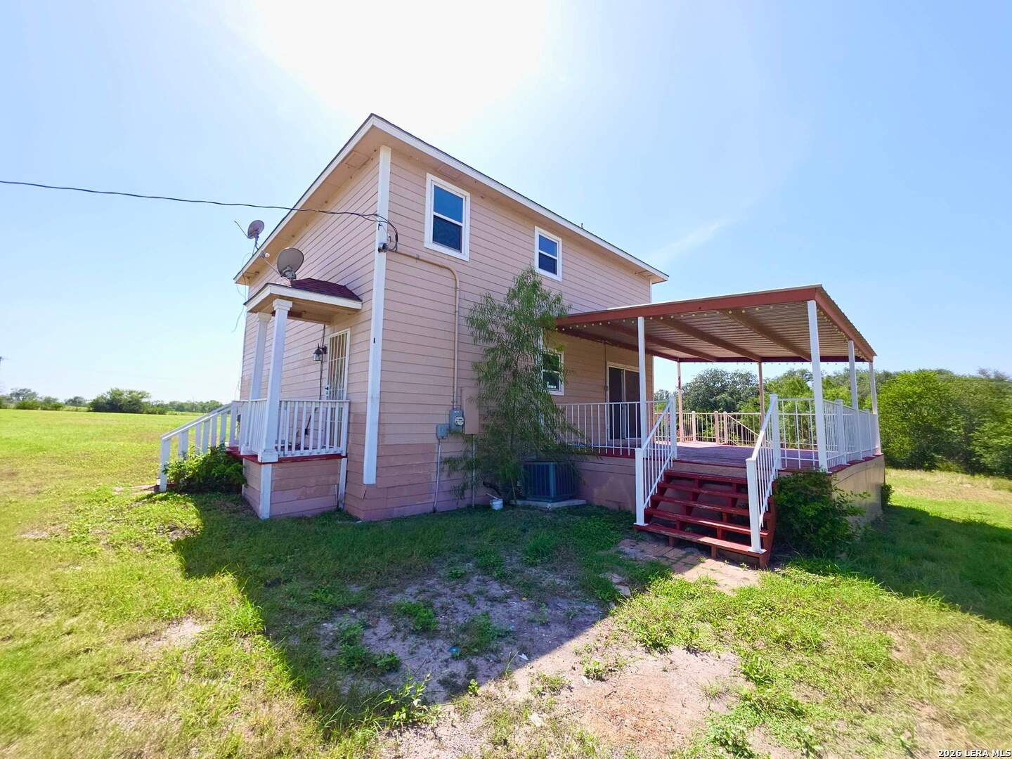 15506 Wheeler Road, Unit 4 Atascosa, TX 78002 - Photo 18 of 23 a front view of a house with garden