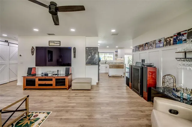 a large kitchen with a large counter top appliances and cabinets