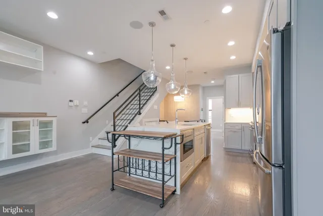 a view of staircase with white walls and a window