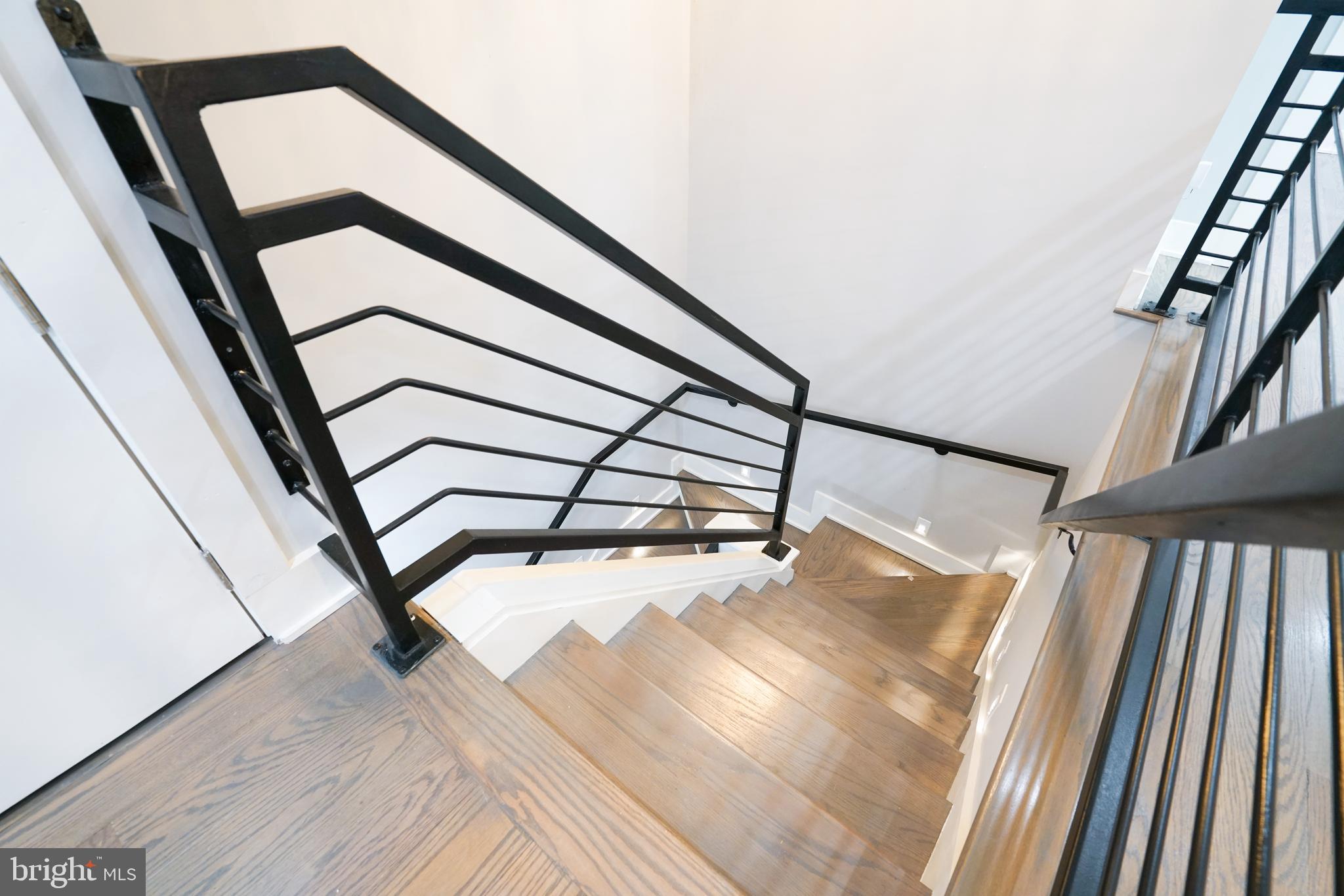 1632 K Street Northeast, Unit PH Washington, DC 20002 - Photo 26 of 69 a view of staircase with white walls and a window