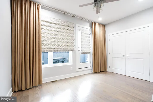 a bathroom with a sink mirror vanity and toilet