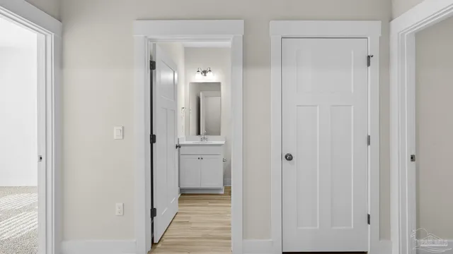a view of a bathroom from the hallway