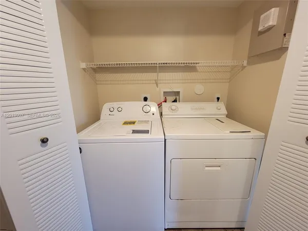 a utility room with dryer and washer