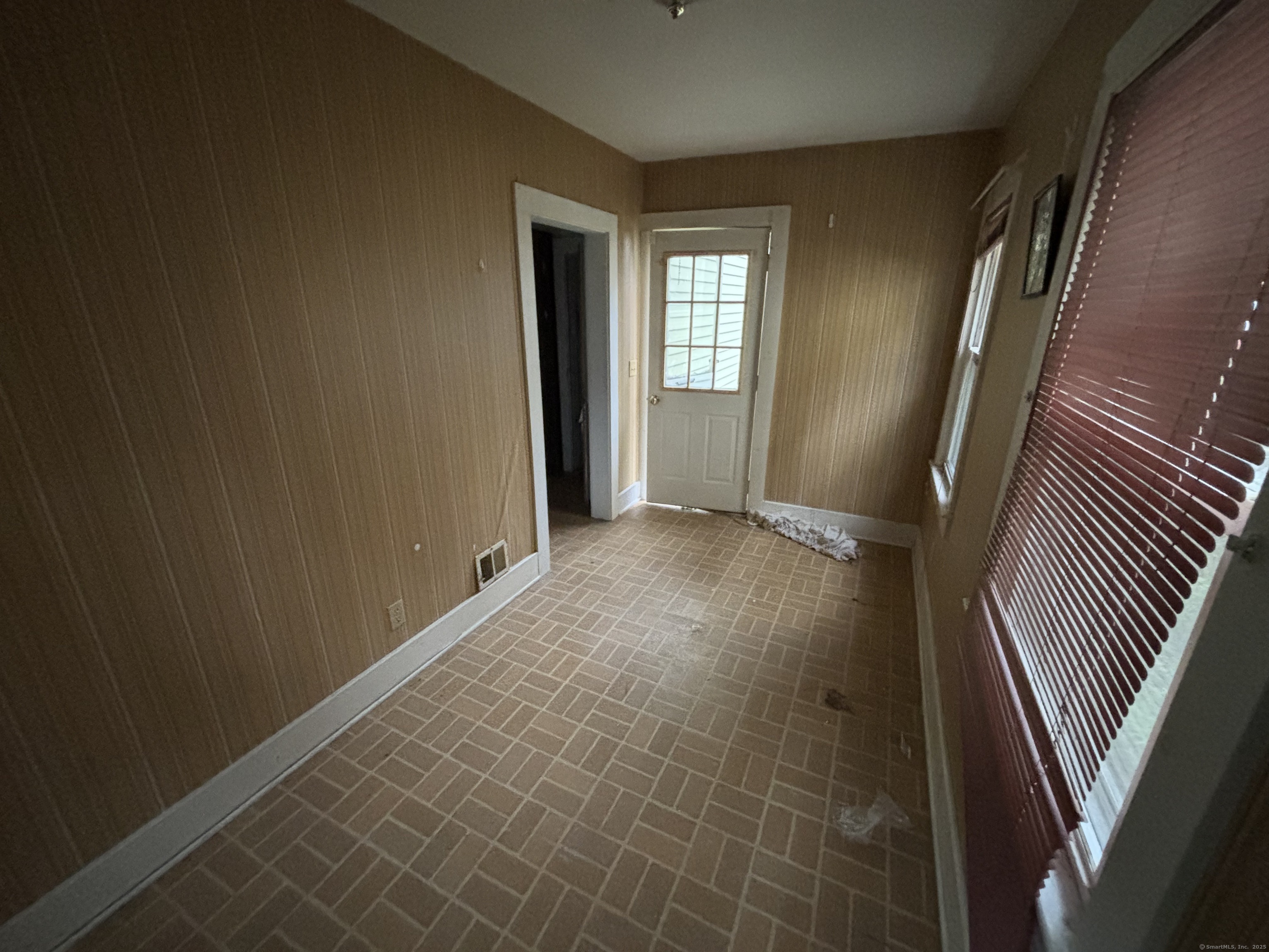 25 Clinton Avenue Middletown, CT 06457 - Photo 14 of 31 a view of an empty room with wooden floor and a window
