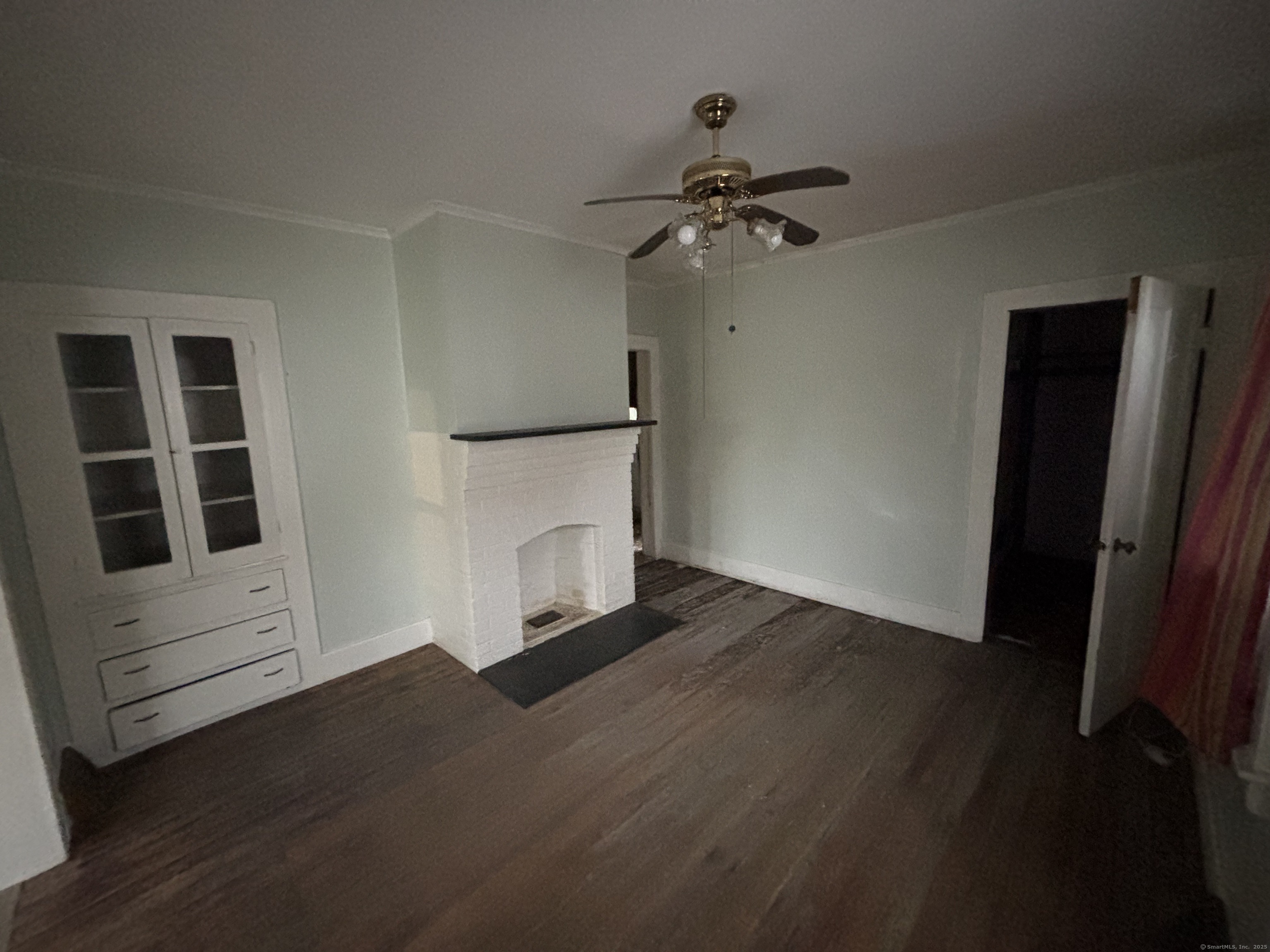 25 Clinton Avenue Middletown, CT 06457 - Photo 5 of 31 a view of an empty room with wooden floor and a window