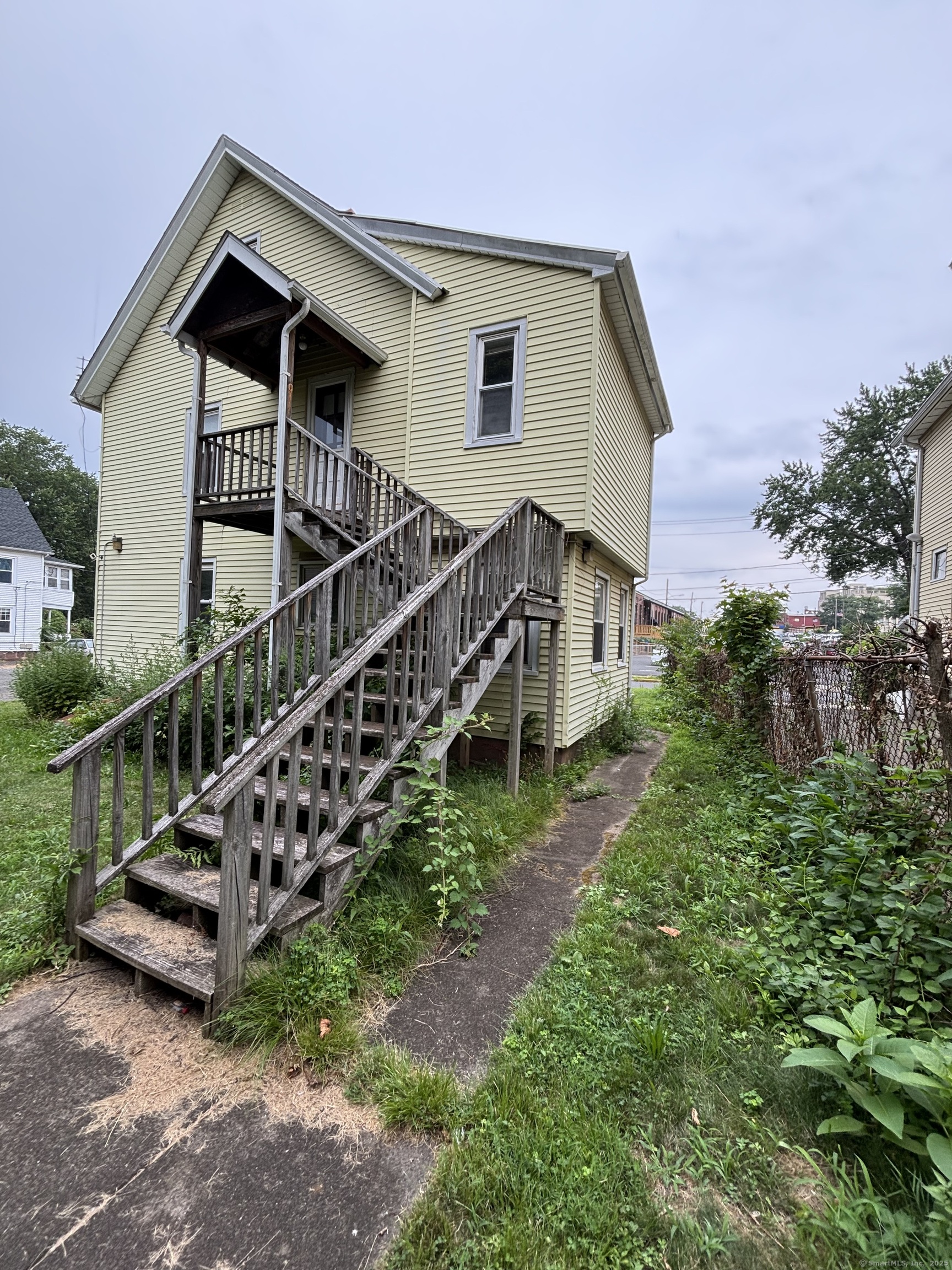25 Clinton Avenue Middletown, CT 06457 - Photo 6 of 31 a view of a house with wooden fence yard and deck