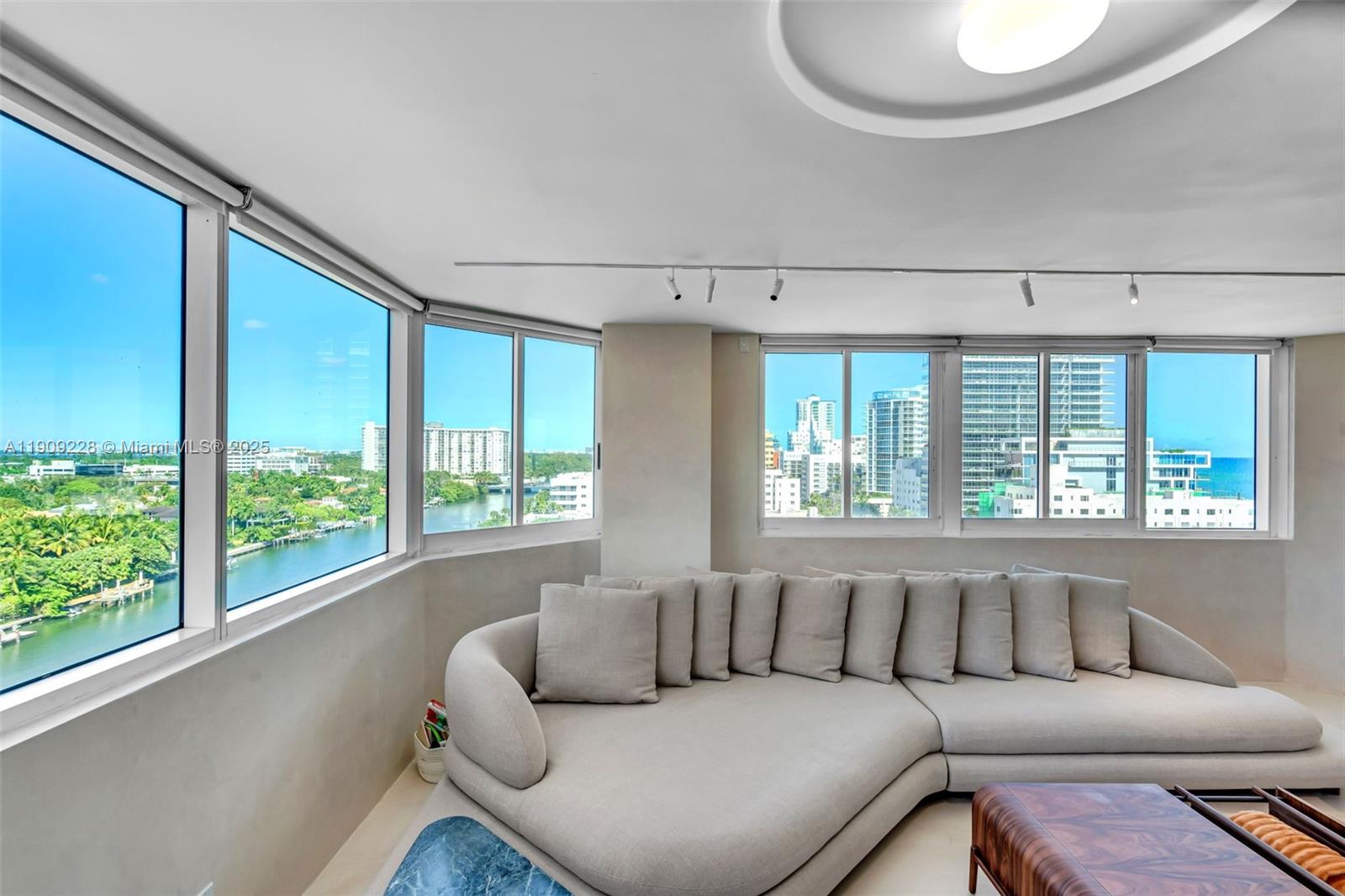 3411 Indian Creek Drive, Unit 1201 Miami Beach, FL 33140 - Photo 16 of 68 a living room with furniture and a large window
