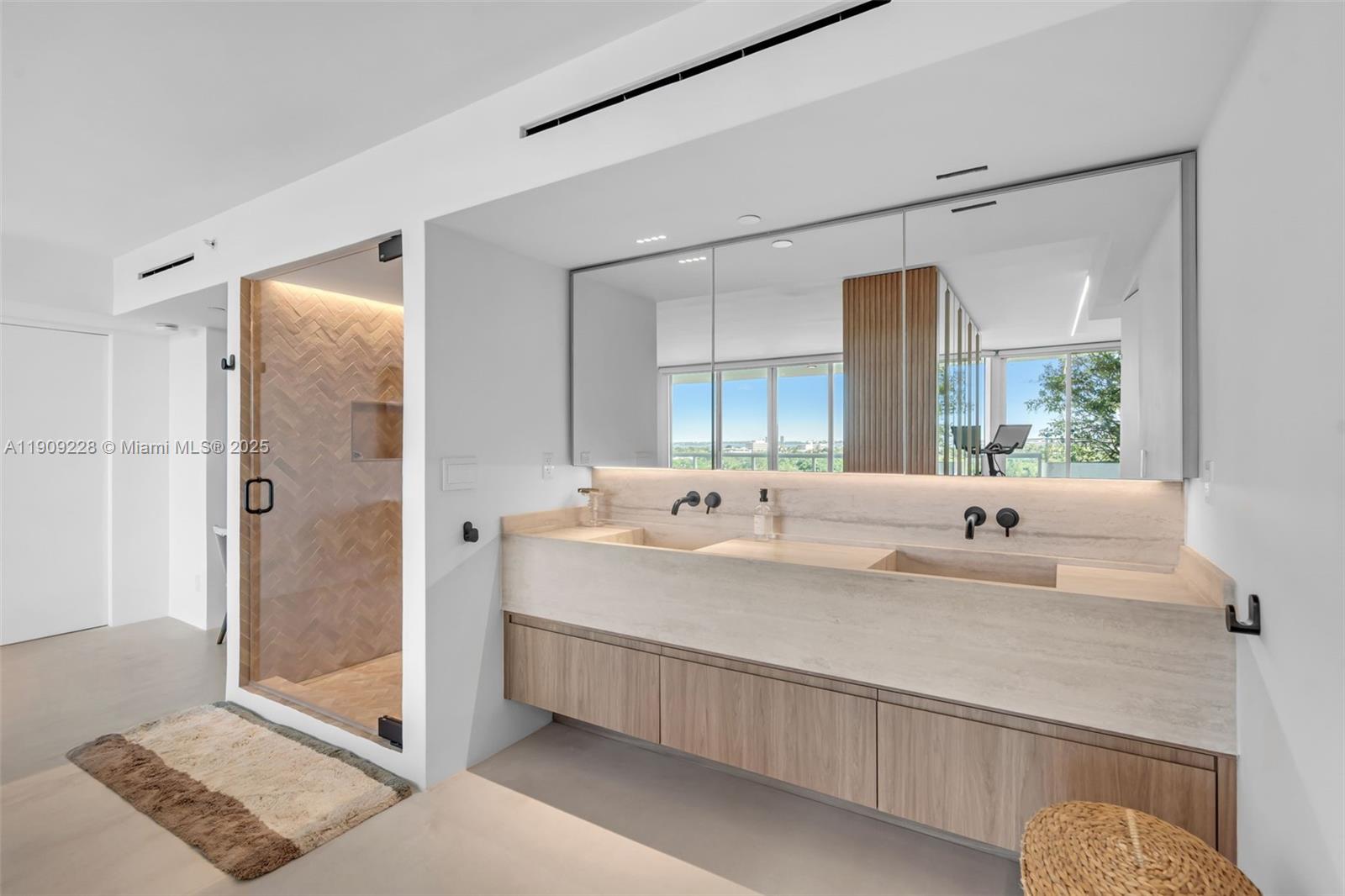 3411 Indian Creek Drive, Unit 1201 Miami Beach, FL 33140 - Photo 29 of 68 a bathroom with a double vanity sink mirror and shower