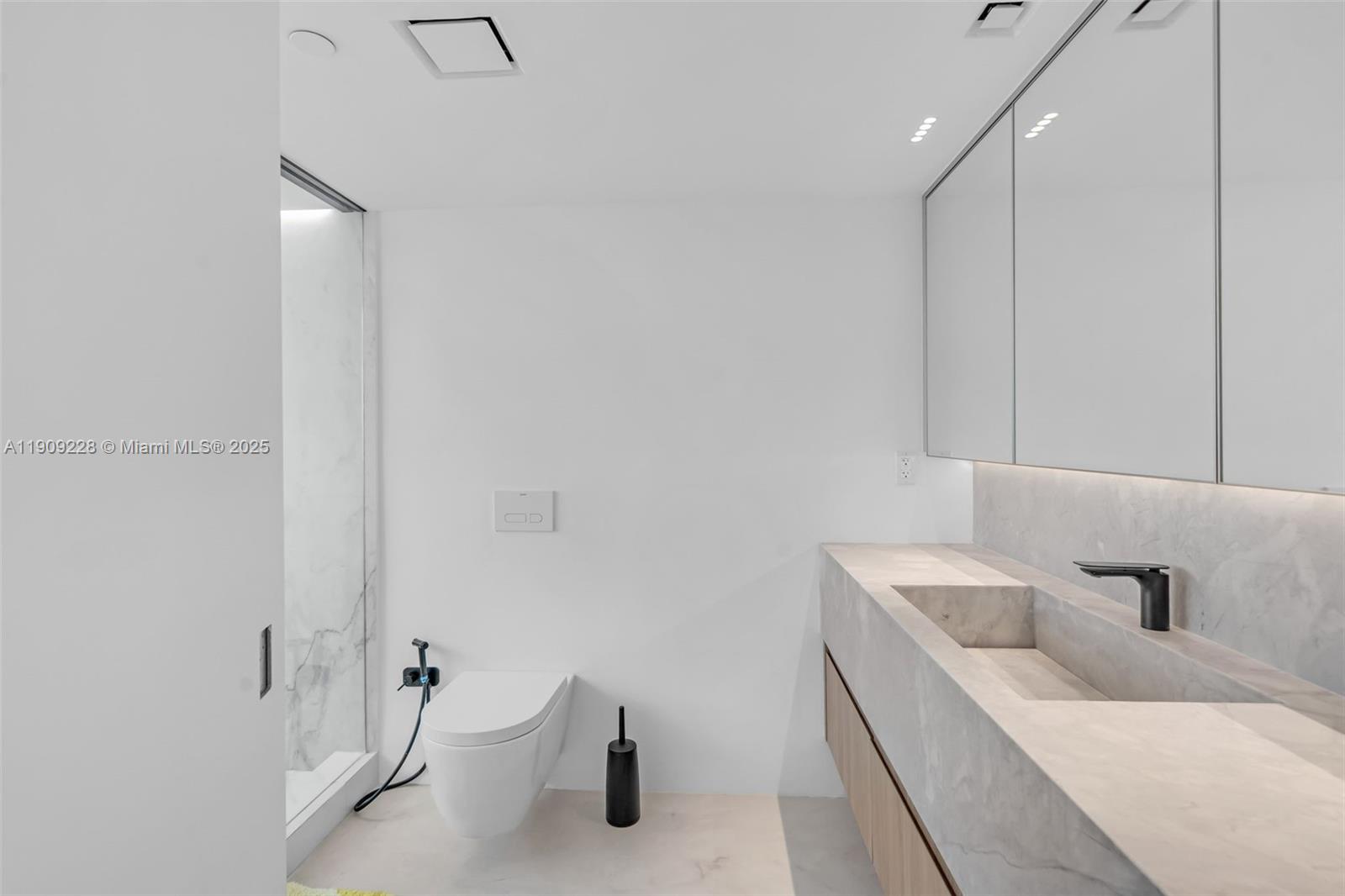 3411 Indian Creek Drive, Unit 1201 Miami Beach, FL 33140 - Photo 33 of 68 a bathroom with a sink and a toilet