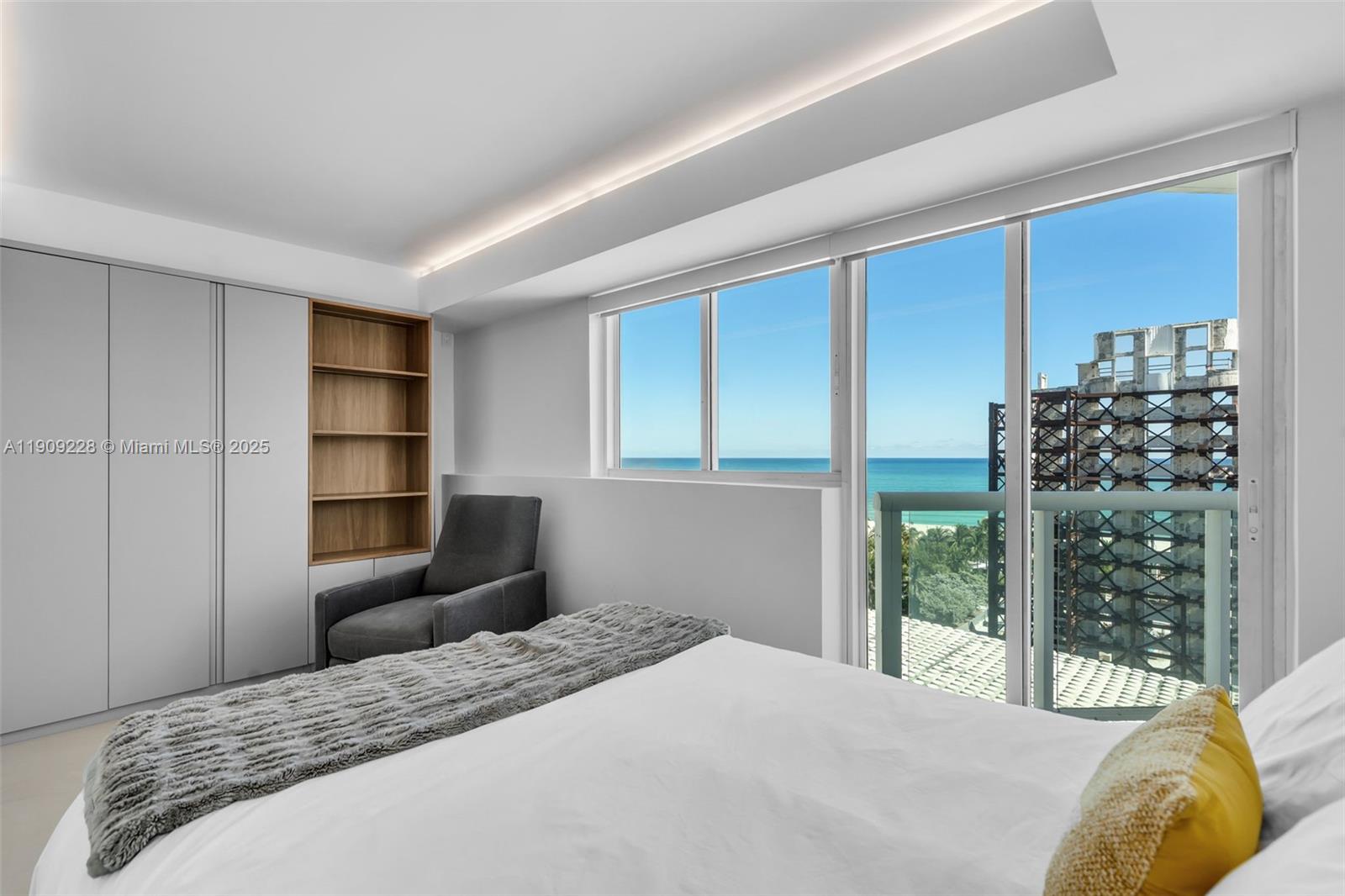 3411 Indian Creek Drive, Unit 1201 Miami Beach, FL 33140 - Photo 36 of 68 a bedroom with a large bed and a window