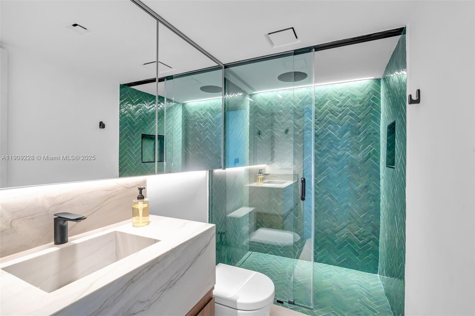 3411 Indian Creek Drive, Unit 1201 Miami Beach, FL 33140 - Photo 39 of 68 a bathroom with a sink a toilet and shower