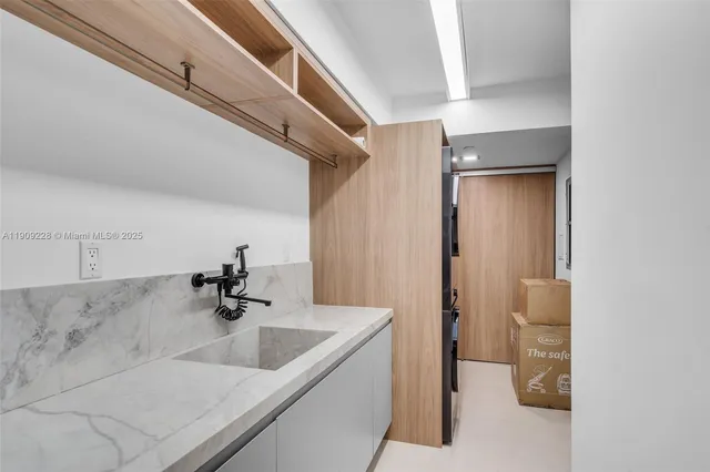 a bathroom with a double vanity sink and mirror
