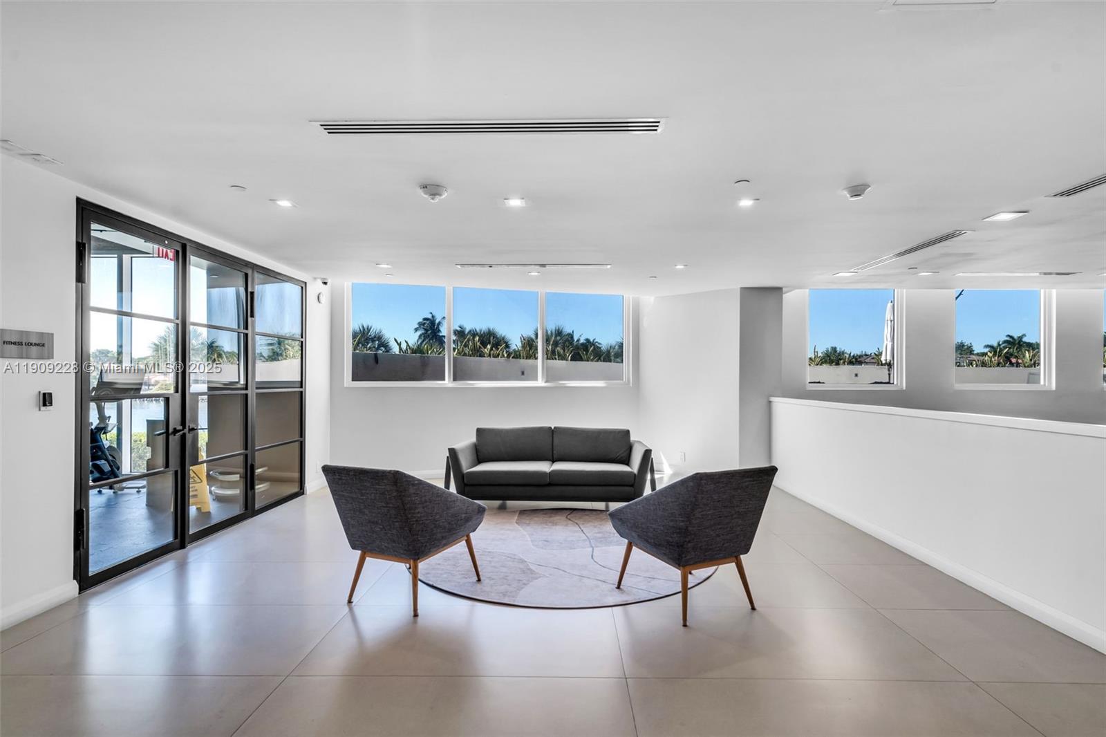 3411 Indian Creek Drive, Unit 1201 Miami Beach, FL 33140 - Photo 47 of 68 a living room with furniture and a large window