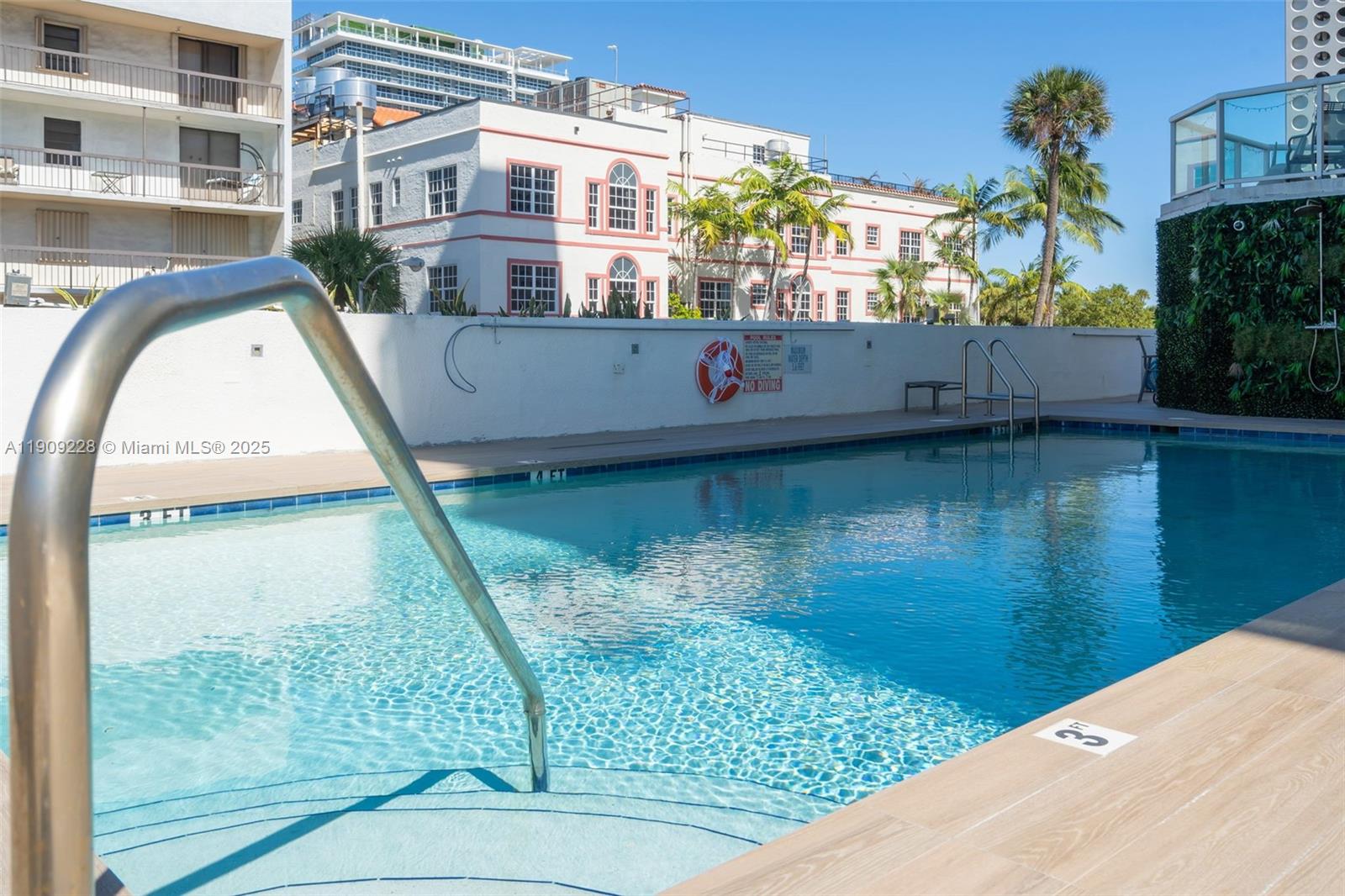 3411 Indian Creek Drive, Unit 1201 Miami Beach, FL 33140 - Photo 52 of 68 a view of roof deck with dining table and chair