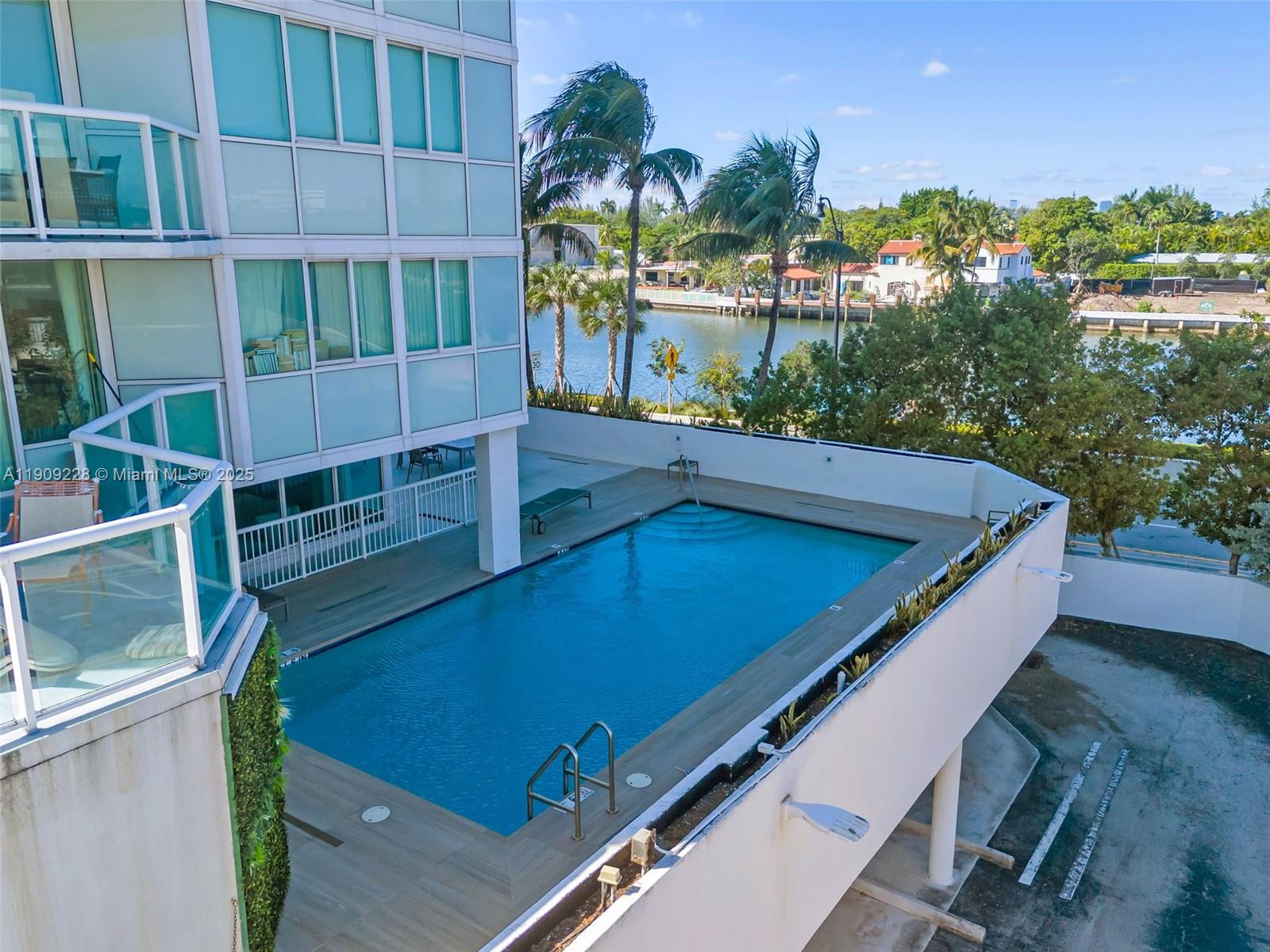 3411 Indian Creek Drive, Unit 1201 Miami Beach, FL 33140 - Photo 55 of 68 a view of balcony with two chairs and a potted plant