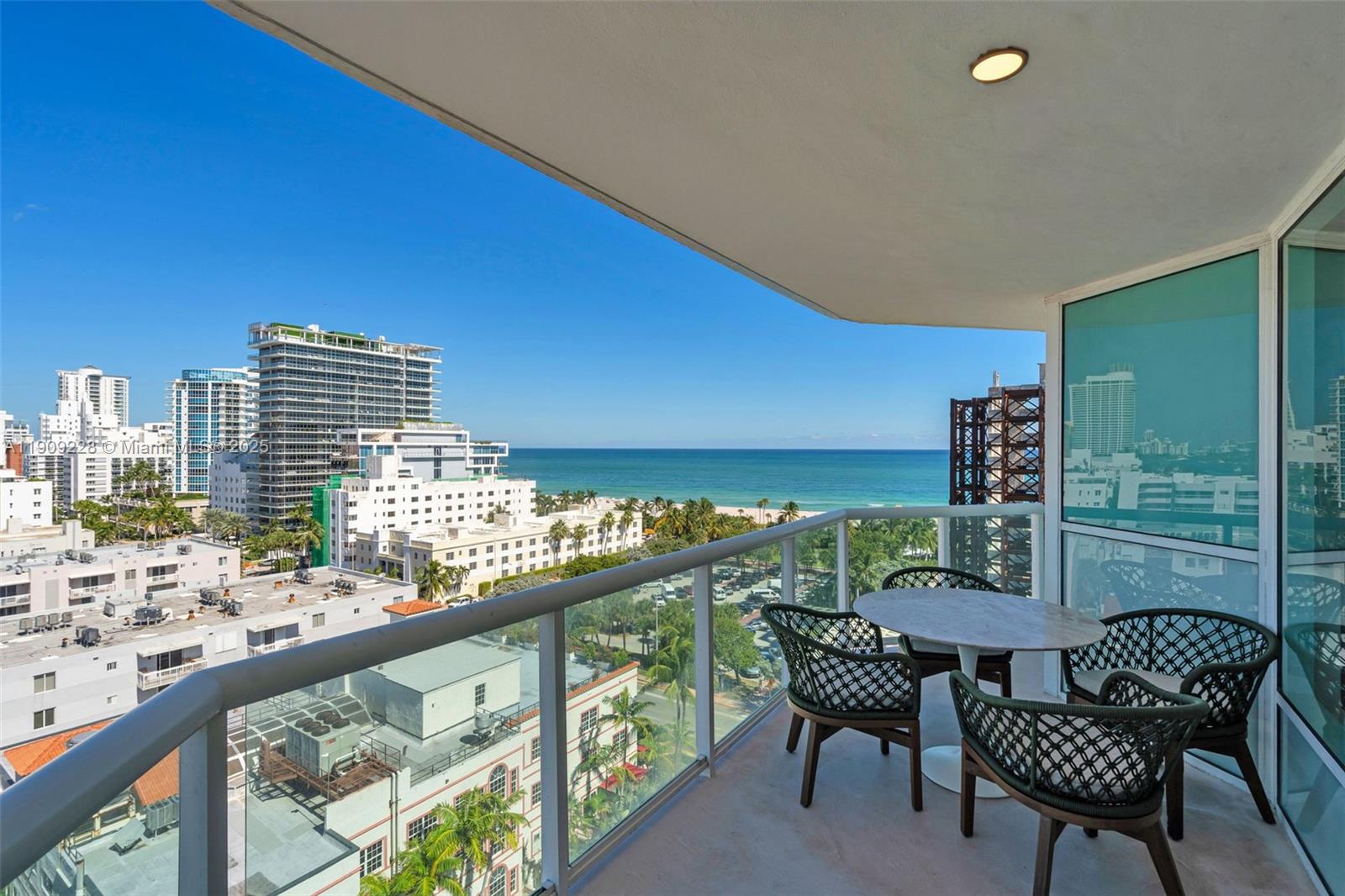 3411 Indian Creek Drive, Unit 1201 Miami Beach, FL 33140 - Photo 6 of 68 a view of balcony with chairs and table