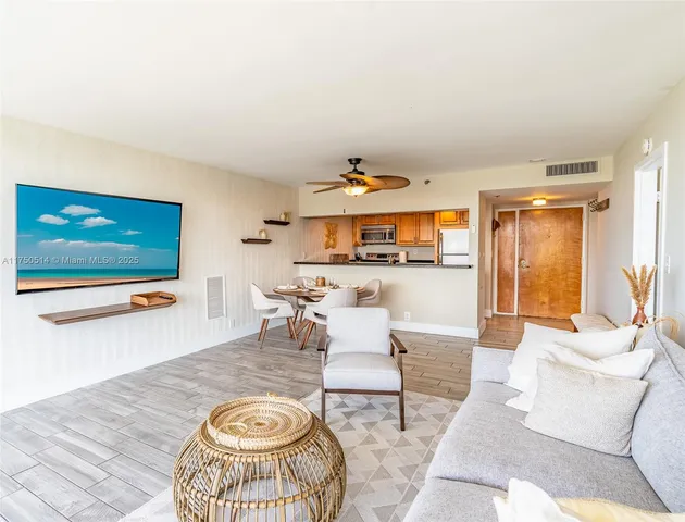 a bedroom with a bed a couch and a large window