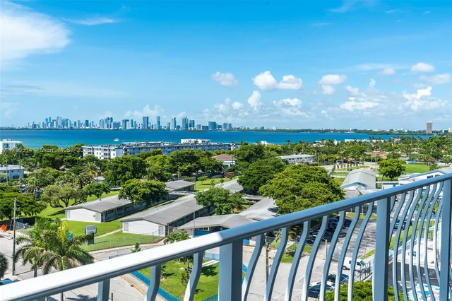 a balcony with wooden floor and lake view