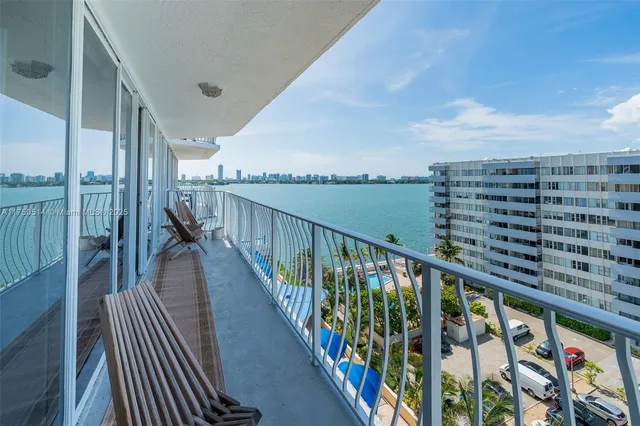 a view of a house with outdoor space and lake view