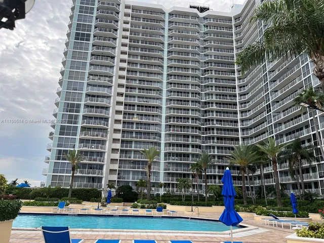 a living room with furniture a dining table and a fireplace
