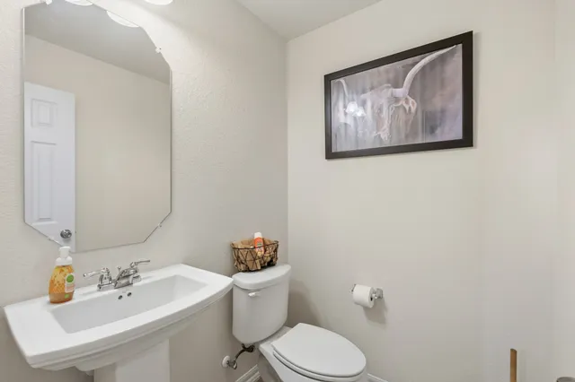 a dining room with furniture a chandelier and window