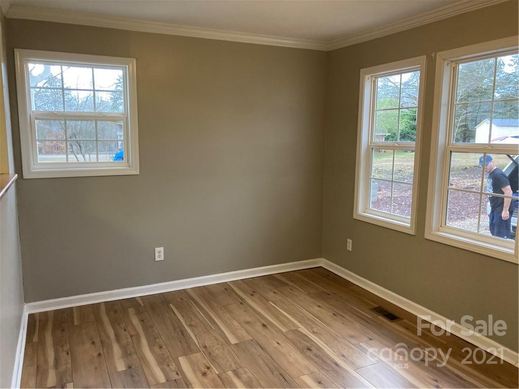1560 Legion Road Fort Mill, SC 29715 - Photo 3 of 8 a view of a room with wooden floor and windows