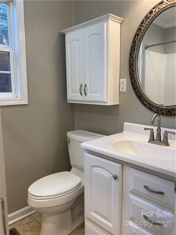 1560 Legion Road Fort Mill, SC 29715 - Photo 5 of 8 a bathroom with a sink a mirror and a toilet