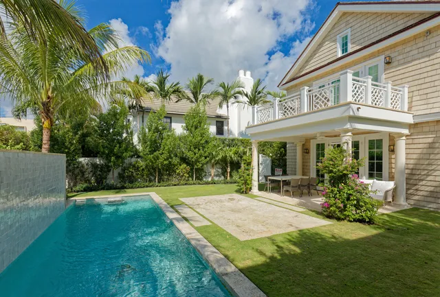 a front view of a building with a garden