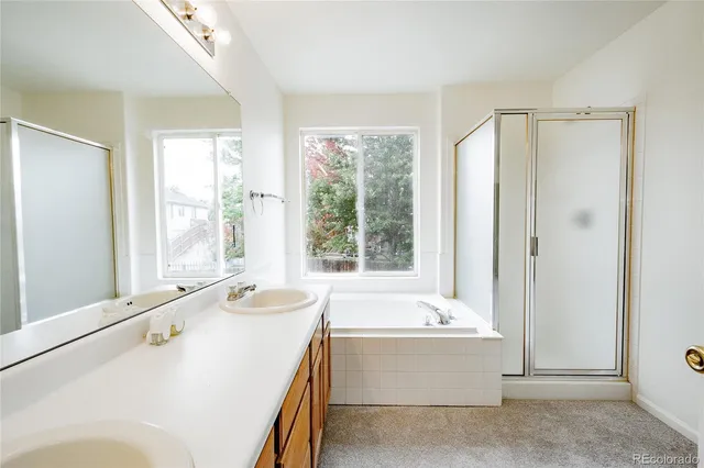 a white toilet sitting next to a shower
