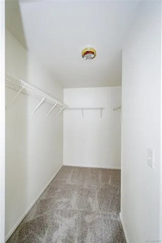 a view of a backyard with wooden fence