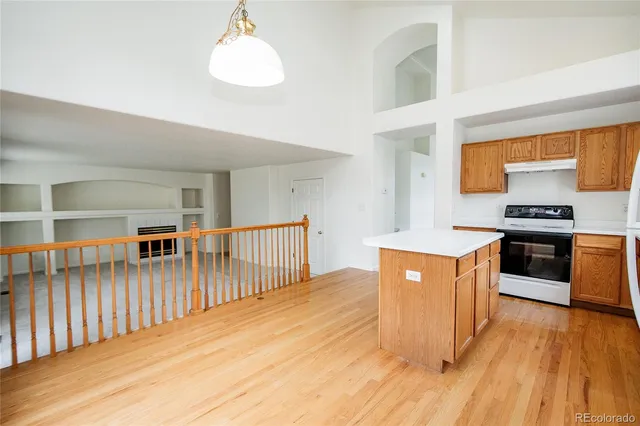 a view of an empty room with a fireplace