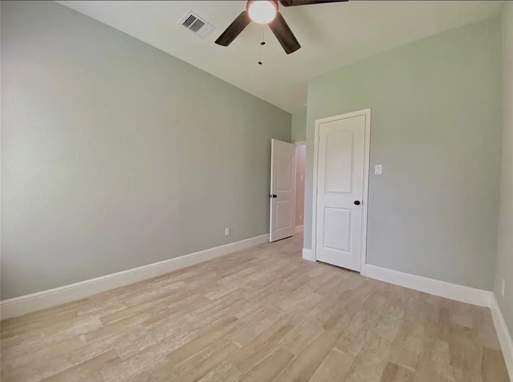 5754 Reed Road, Unit B Houston, TX 77033 - Photo 12 of 15 wooden floor in an empty room