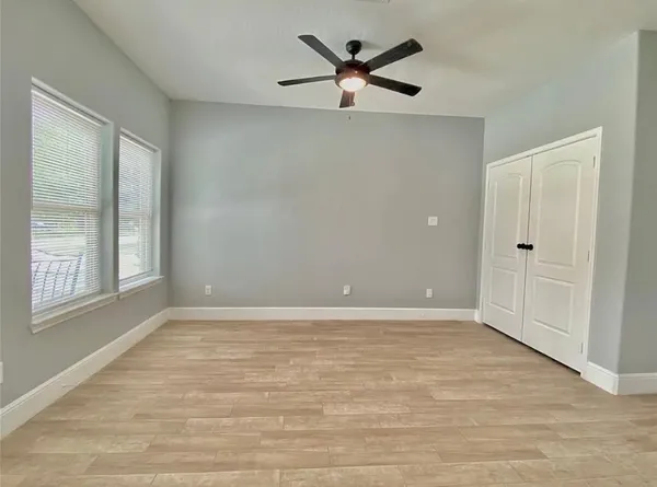 a view of an empty room with a window