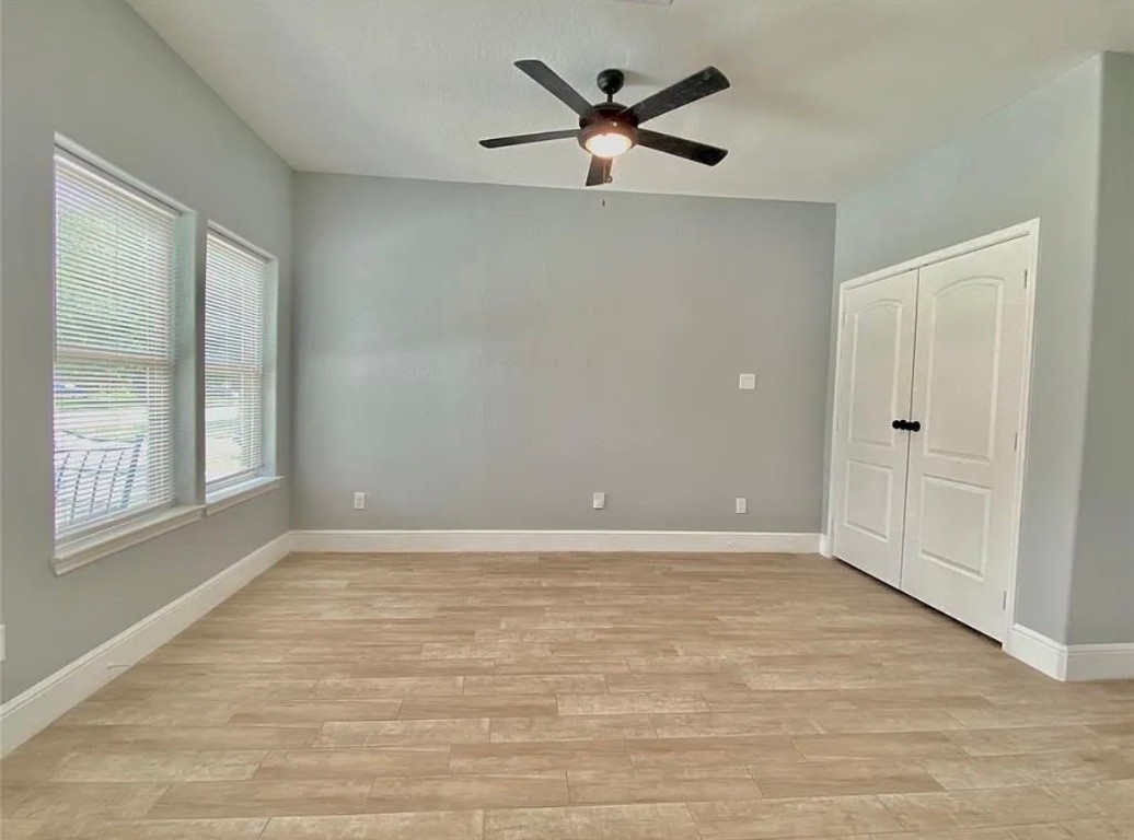 5754 Reed Road, Unit B Houston, TX 77033 - Photo 5 of 15 a view of an empty room with a window