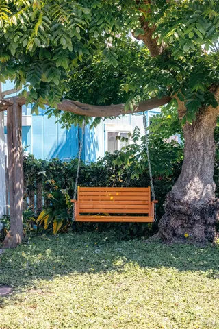 a view of a house with wooden fence