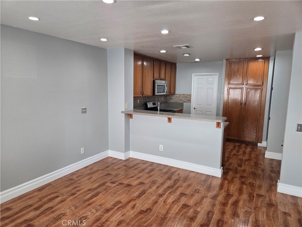 333 Pony Expressway San Dimas, CA 91773 - Photo 11 of 12 a view of a kitchen with a sink and a refrigerator