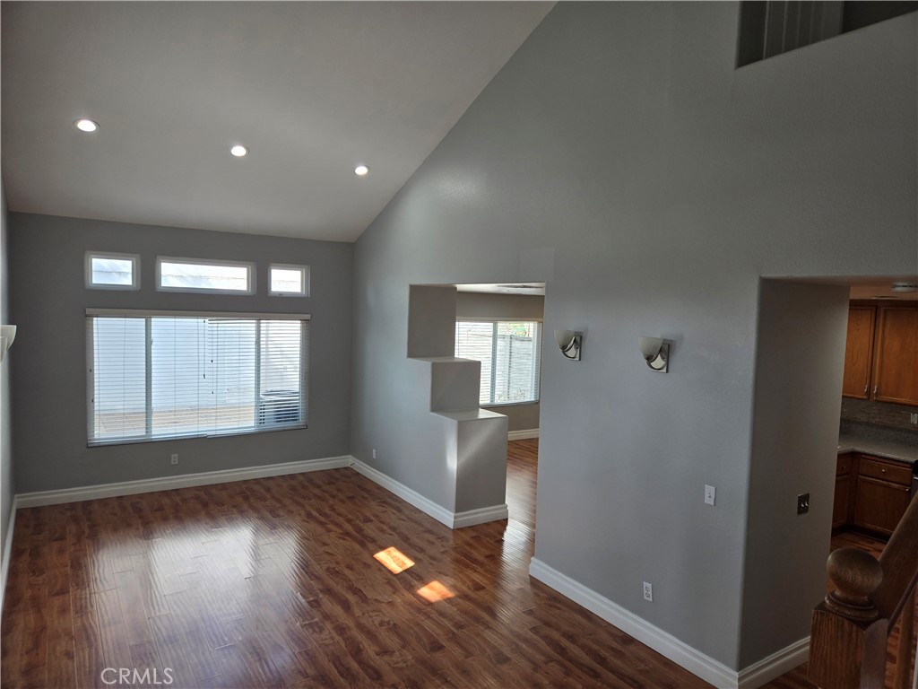 333 Pony Expressway San Dimas, CA 91773 - Photo 4 of 12 an empty room with wooden floor and windows