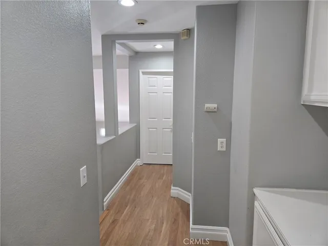 a view of a bathroom from a hallway