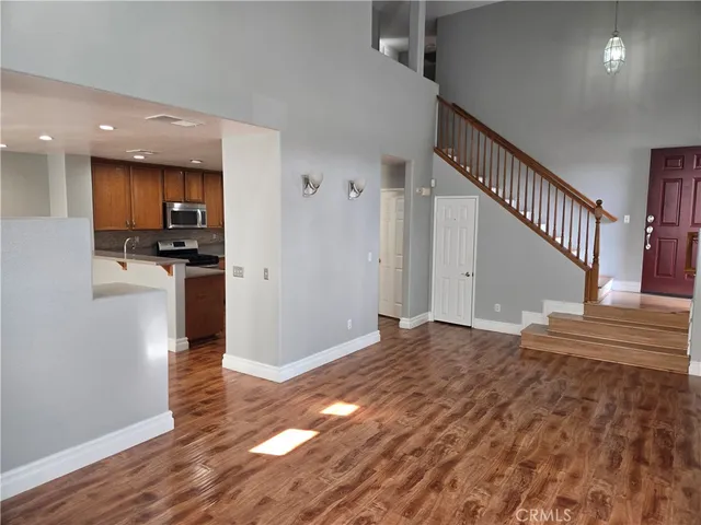 a view of a kitchen cabinets and wooden floor