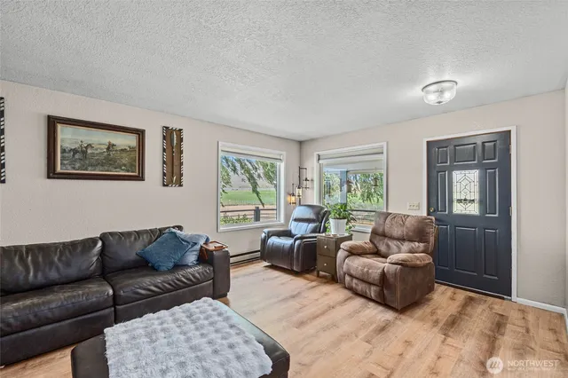 a living room with furniture and a window