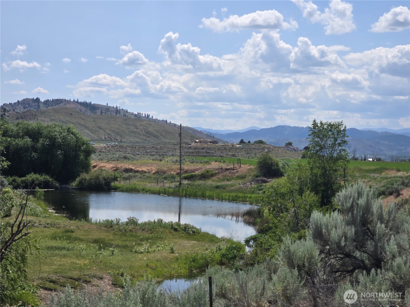 93 Warren Road Tonasket, WA 98855 - Photo 23 of 31 a view of a lake