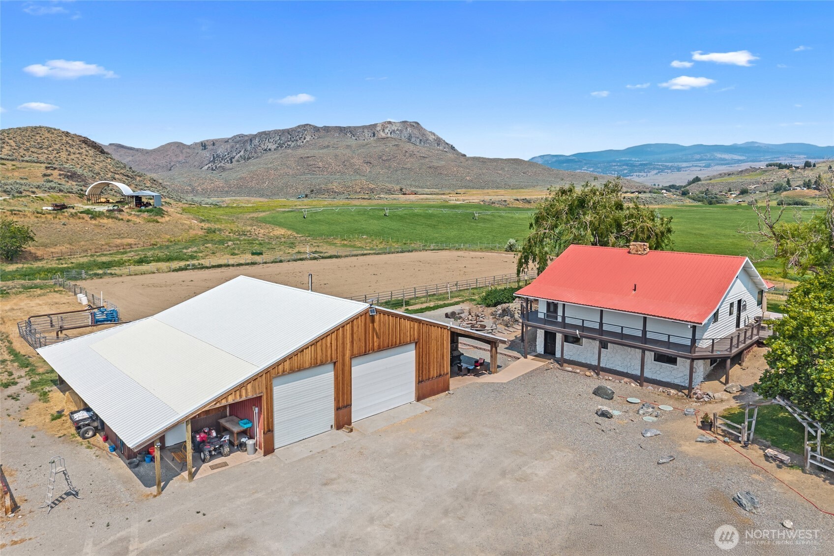 93 Warren Road Tonasket, WA 98855 - Photo 4 of 31 aerial view of a house with a mountain