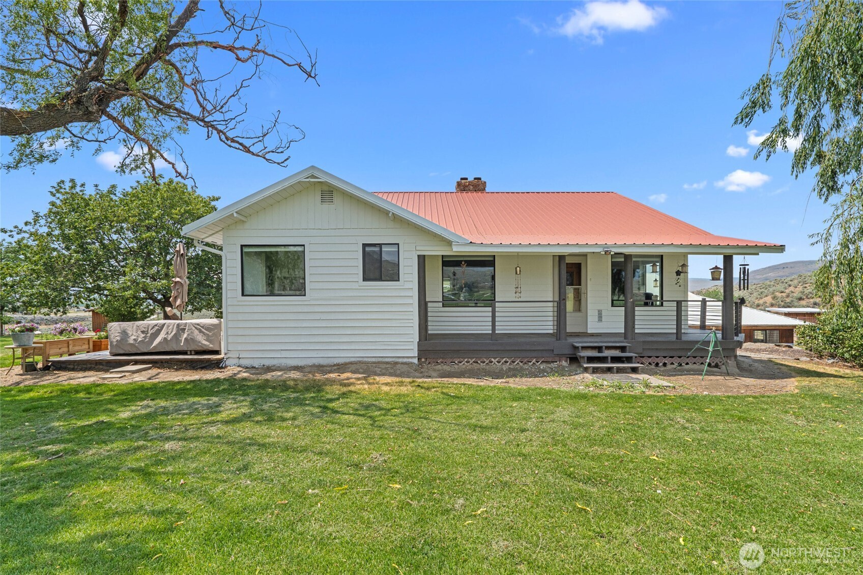 93 Warren Road Tonasket, WA 98855 - Photo 6 of 31 a front view of a house with a garden and yard